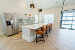 An exquisite kitchen in Ocala apartments featuring stainless steel appliances and elegant wood floors.