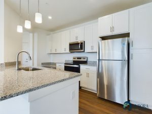 Apartments for rent in Ocala A modern kitchen in apartments for rent in Ocala with stainless steel appliances and white cabinetry. Aurora St. Leon Apartments in Ocala 2150 NW 21st Avenue | Ocala, FL 34475 (352) 233-4133